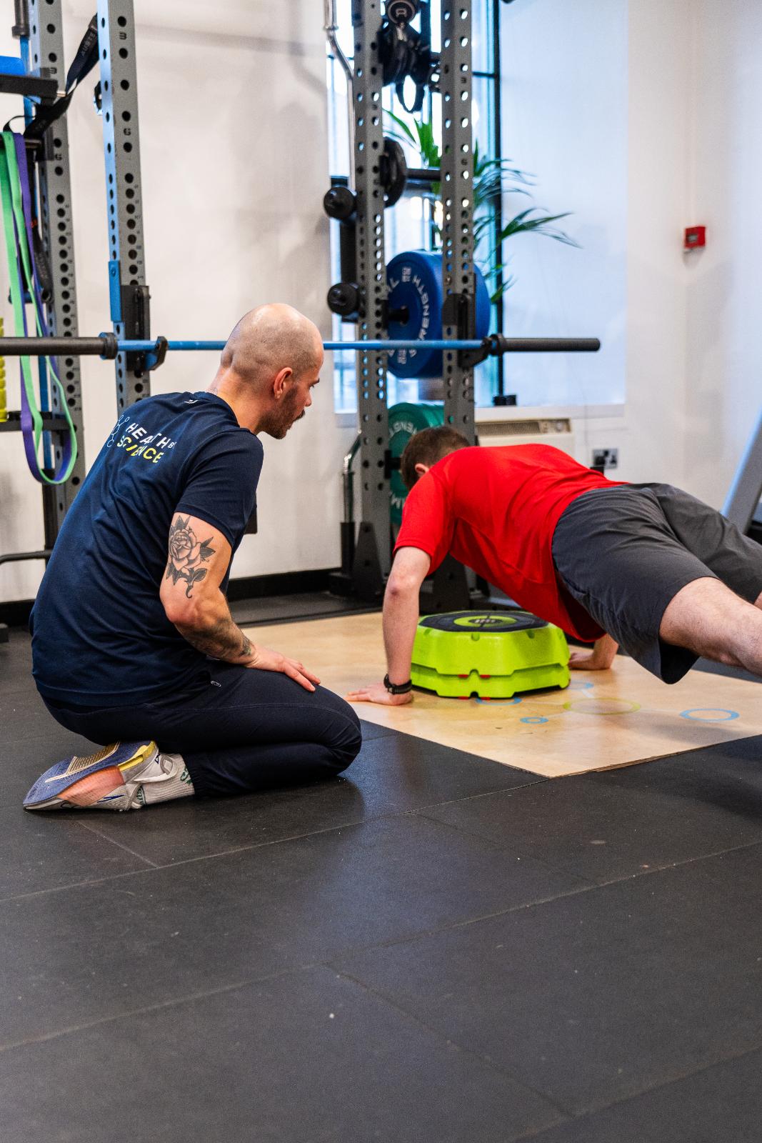 KA3_3148 Clinical supervision of a push-up assessment using a balance trainer to assess core and upper body stability.