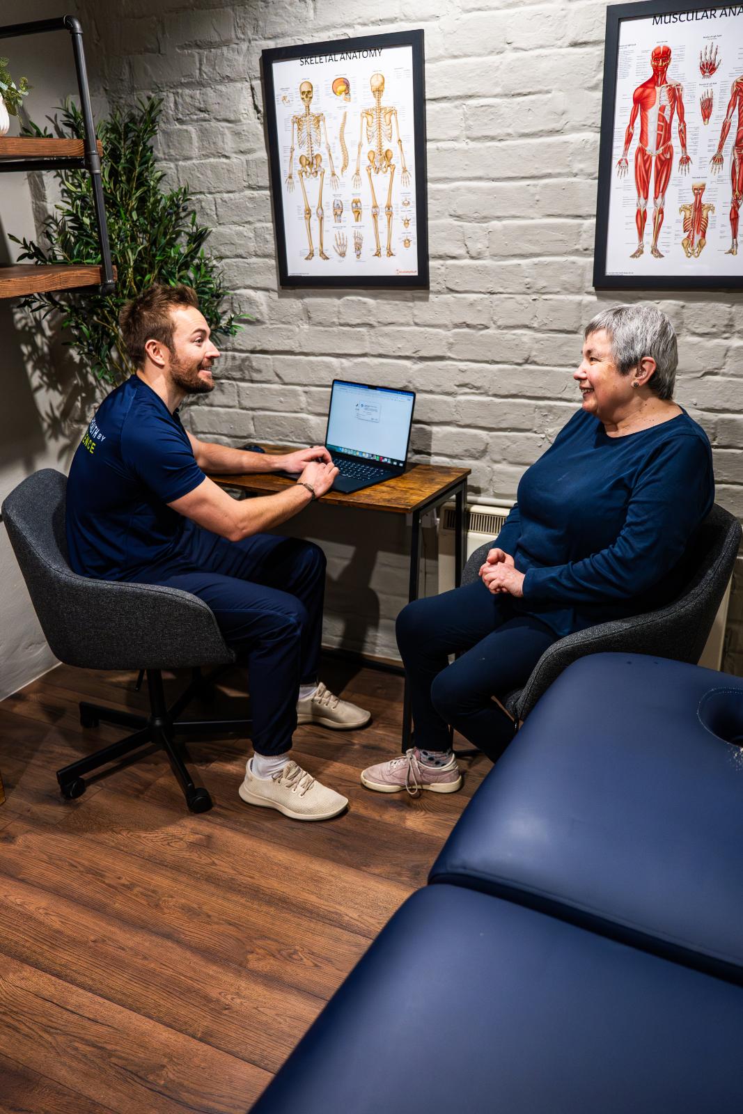 KA3_4197 Professional clinical consultation between a Health by Science practitioner and a senior patient, reviewing progress on a laptop in Leith.